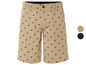 Beige shorts met een herhalend patroon van ruiters