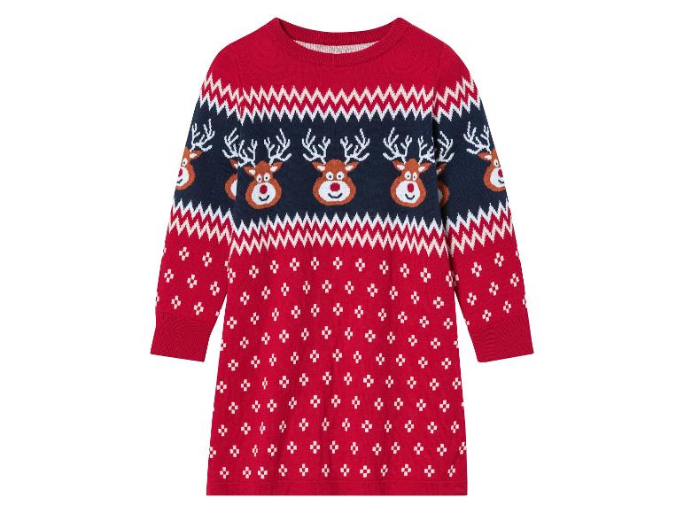 Een rood gebreide kerstjurk met rendieren.