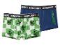 Twee paar jongensboxershorts, één groen-wit geblokt met creepergezichten, de andere blauw met creeperafbeeldingen.