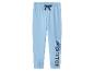 Blauwe kinderjoggingbroek met cartoonfiguurprint en 'STITCH'-tekst op de pijp.