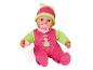 Babypop in roze en groene kleding, met speen en flesje.