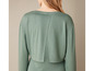 Een groene longsleeve trui met een open rug