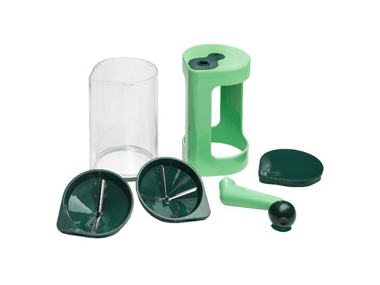Groene groentespiraalsnijder met transparante container en diverse messen.