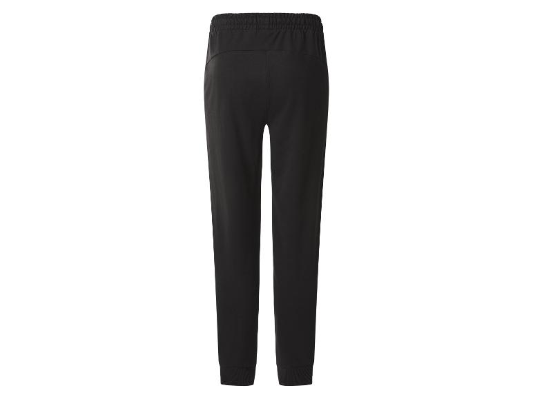 Zwarte joggingbroek met elastische tailleband en geribde boorden, achteraanzicht.