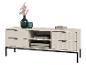 Witte tv-kast met geribbelde lades, zwarte poten en decoraties