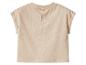 Beige baby T-shirt met korte mouwen en knoopsluiting op de rug.