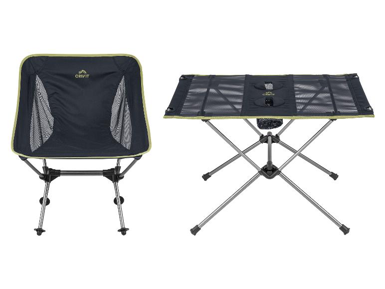Opvouwbare campingstoel en tafel in zwart met groene accenten.