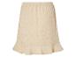 Beige rok met opengewerkte details, boho stijl.