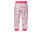 Kinderbroek met roze en paarse stippenprint.