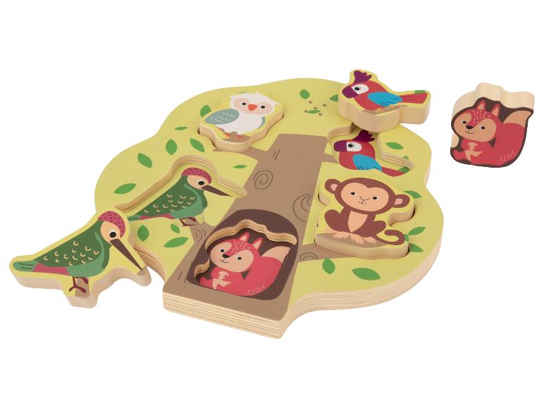 Houten boomvormige puzzel met dierenstukken, waaronder een vos, uil, vogels en aap.