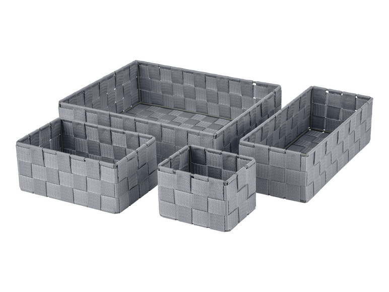 Vier grijze opbergmanden van geweven stof.