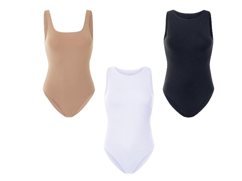 Drie body's in neutrale kleuren: beige, wit en zwart.