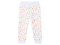 Witte broek met roze, gele en rode hartjes print.