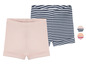Twee paar baby shorts: een gestreepte en een effen roze.