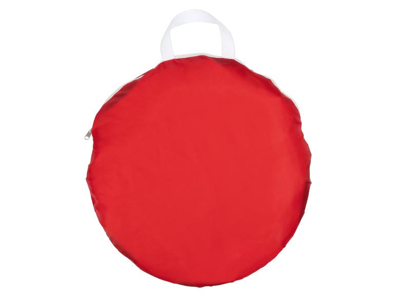 Een rode ronde tas met een witte handgreep