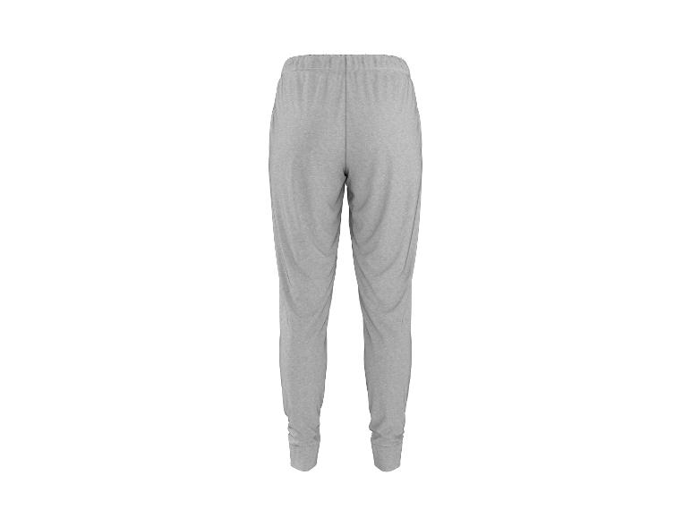 Grijze joggingbroek met elastische tailleband en boorden bij de enkels, achteraanzicht.