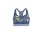 Blauwe sportbeha met geel patroon.
