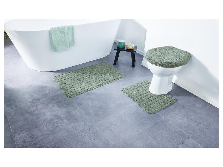 Badkamermatten en een toiletbril in grijsgroen.