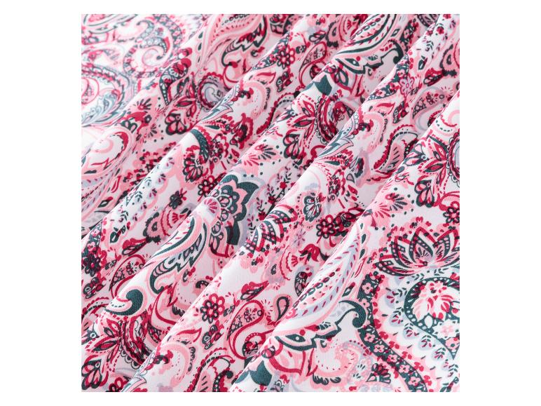 Een close-up van roze en groene paisley stof.