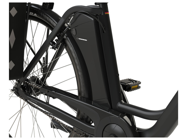 Close-up van een zwarte Prophete e-bike met een geïntegreerde batterij.