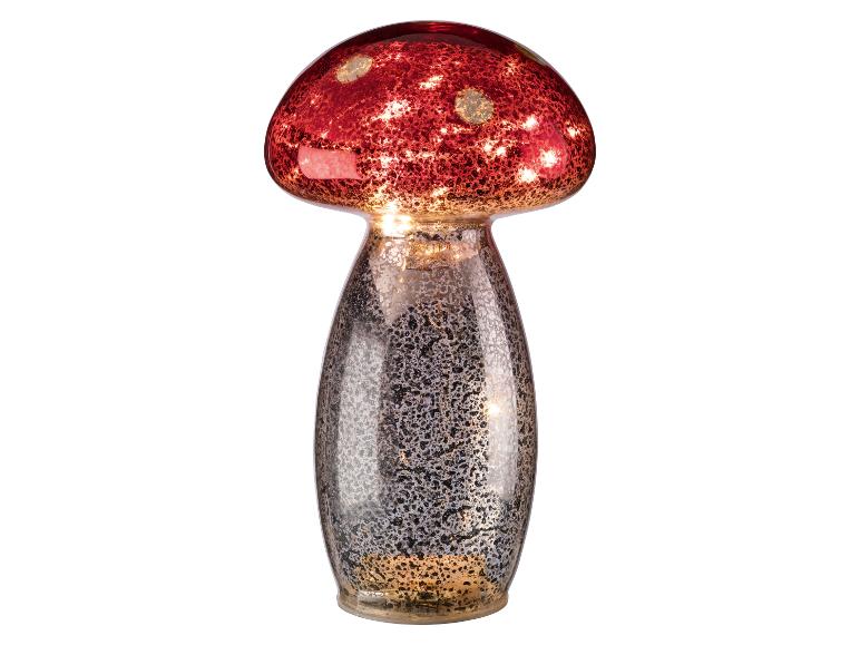 Rode paddestoel lamp met gespikkeld zilveren voetstuk.