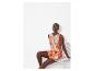 Zomerset: shorts en top met abstract oranje en groen dessin.