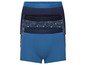 Drie blauwe boxershorts, een met tropische print