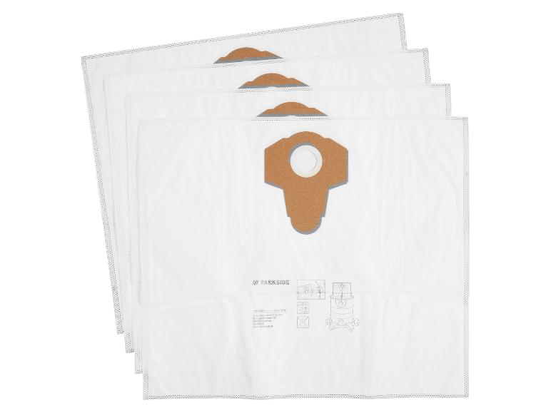 Vier witte stofzuigerzakken met een bruine kartonnen bevestiging