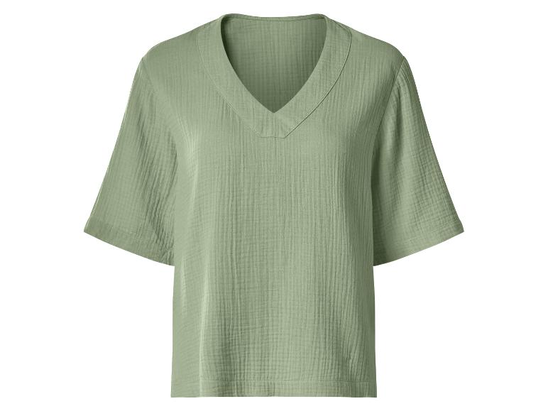 Lichtgroene V-hals blouse met korte mouwen, gemaakt van kreukelstof.