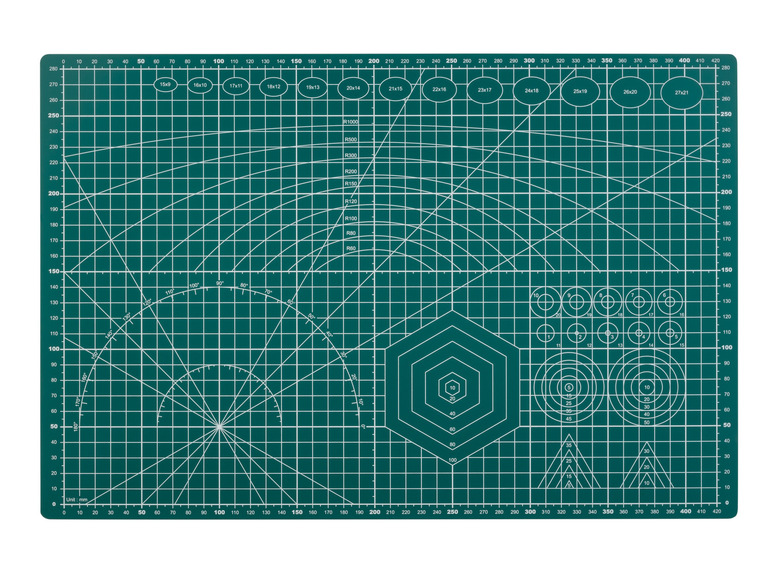 Een groene snijmat met rooster, cirkels en zeshoek voor knutselen.