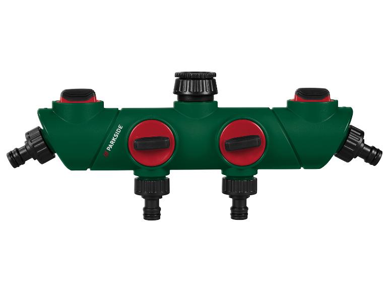 Groene Parkside watersplitter met vier uitgangen en twee rode kranen.