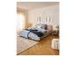 LIVARNO home microvezel-jersey hoeslaken op een tweepersoonsbed in een slaapkamer.