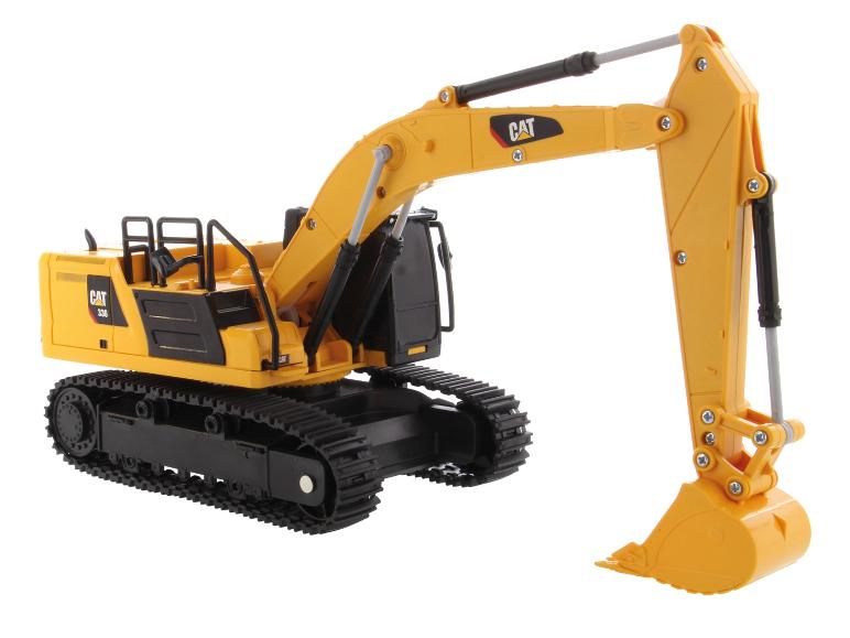 Geel CAT 336 graafmachine speelgoed op witte achtergrond