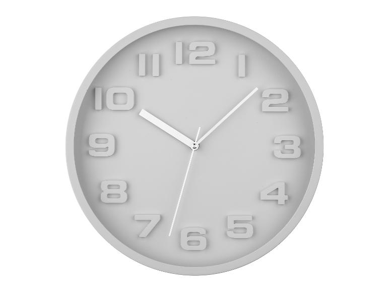 Grijze ovale wandklok, minimalistische stijl.