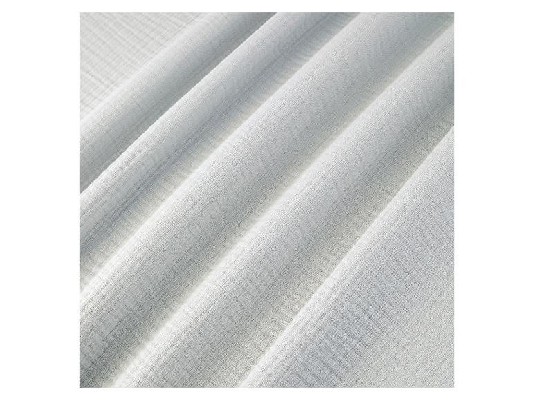 Close-up van een lichtgrijze geweven stof.