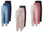 Set van 9 kinderleggings in diverse kleuren en patronen, waaronder hartjes en stippen.