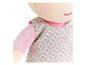 Pluchen pop in een jurk met bloemen- en stippenpatroon