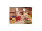 Twee speelgoedkonijntjes in een poppenhuis met een teddybeer en hobbelpaard.
