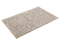 Zachte, beige badmat.