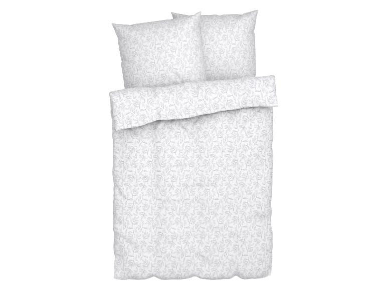 Wit beddengoed met grijs bladpatroon.