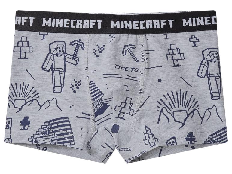 Grijze boxershorts met Minecraft-thema, met personages, gereedschap en de tekst 'MINECRAFT' op de tailleband.