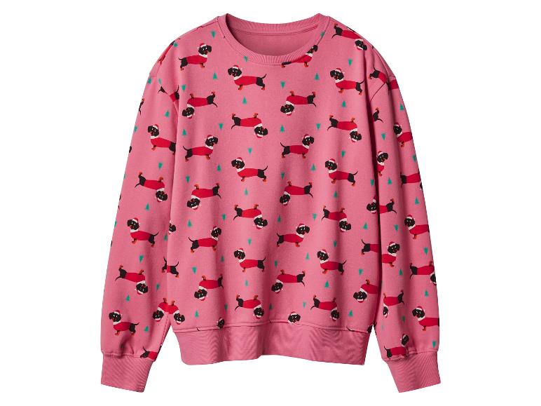 Een roze sweatshirt met kerstprint van teckels en kerstbomen.