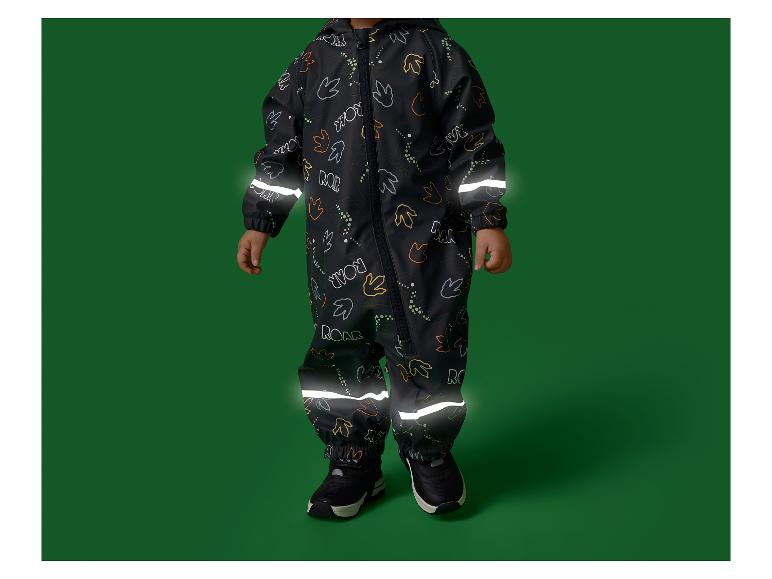 Zwart kinderregenpak met reflecterende strepen en dinosaurusprint.