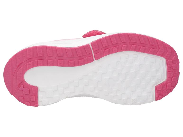 Roze en witte zool van een kindersportschoen met een gestructureerd grippatroon.