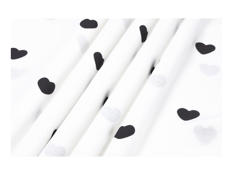 Witte stof met zwarte hartvormige stippen