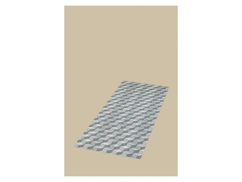 Vloerkleed met 3D kubuspatroon in grijze en witte tinten op een beige achtergrond.