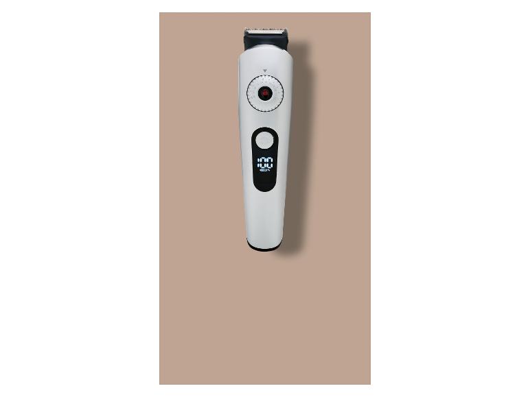 Witte tondeuse met digitaal display dat 100% batterij toont en een draaiknop voor lengteaanpassing.