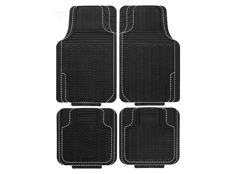 Set van vier zwarte rubberen automatten met witte gestippelde randen.