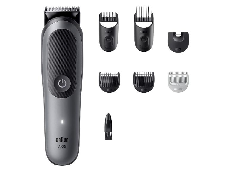 Haar- en baardtrimmer met diverse opzetstukken en kammen.