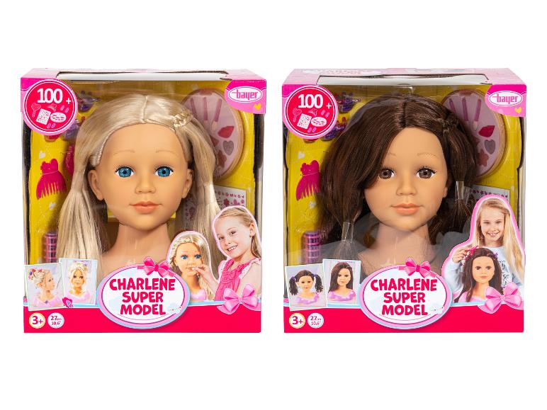 Twee Bayer Charlene Super Model stylinghoofden, één blond en één brunette, in verpakking.